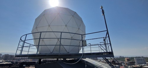 Geodesic satellite radome on rooftop platform